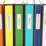 assortment-of-personally-labeled-binders-organizing-your-office-workspace
