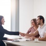 Couple speaking with a mortgage broker