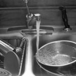 Washing Dishes in Sink