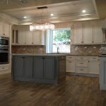antique-white-cabinets-with-gray-island