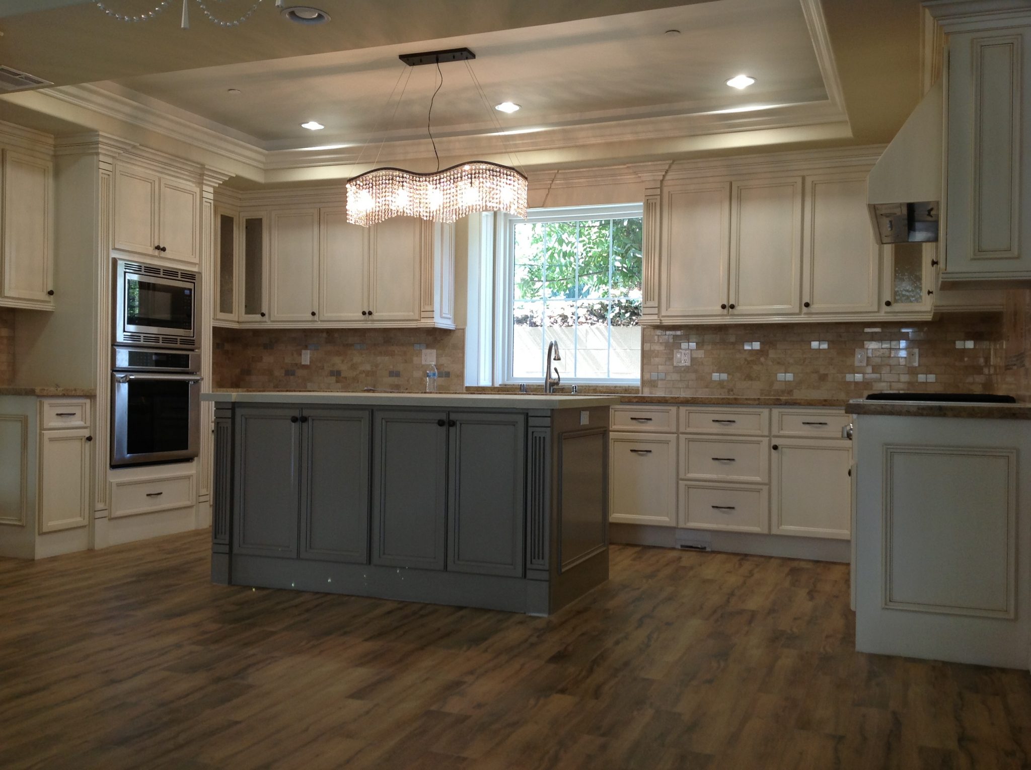 Gray Island With White Cabinets